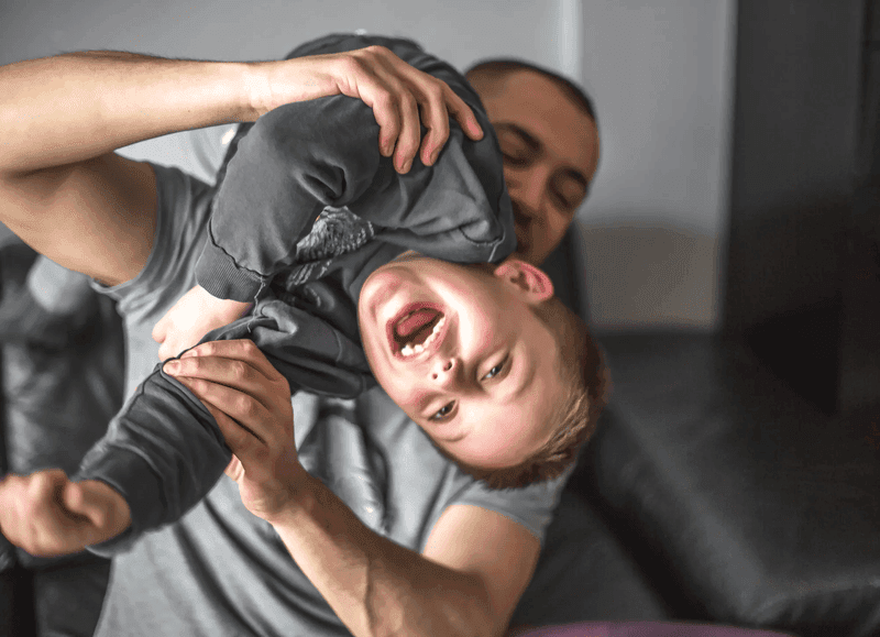Father plays with his son